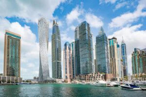 Stunning view of Dubai Marina's iconic skyline with high-rise skyscrapers and calm waterfront.